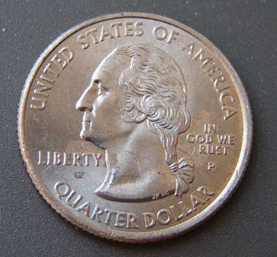 2005-P Kansas quarter error coin reading IN GOD WE RUST — grease-filled die hid the T in TRUST